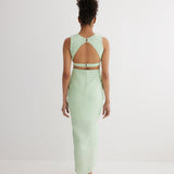 "Back view of the Adelice Mint Green Dress showing the open back and side cutouts that enhance the silhouette."