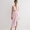 "Front view of the Adelice Pink Dress showcasing a deep V neckline, ruched center, high front slit, and asymmetrical skirt."