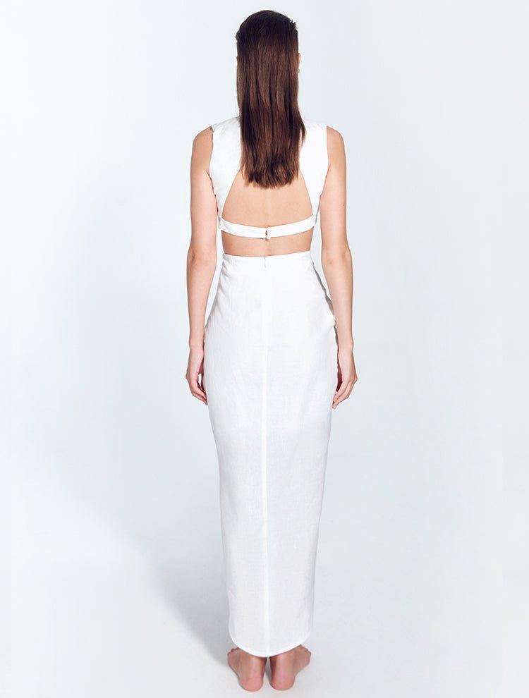 "Back view of Adelice white dress featuring an open back with side cutouts, showcasing a flirty and feminine silhouette."