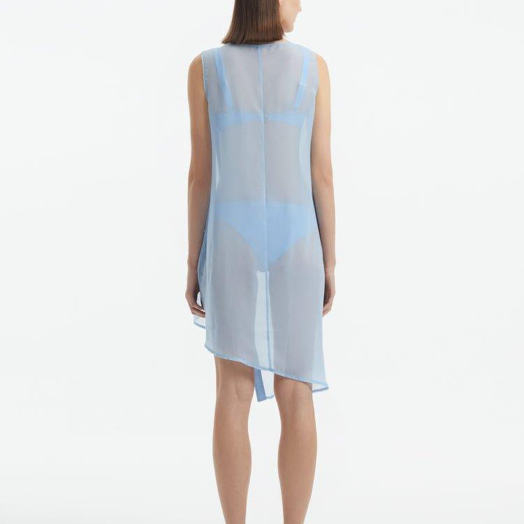 Adora Baby Blue Sheer Sleeveless Asymmetric Dress with Gold Button Detail | Moeva | Dress | Each week unveils new pieces—luxury swimwear, fluid resort silhouettes, and elevated summer-to-evening essentials designed to carry you from coastal escapes to city nights.