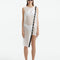 "Model wearing the Adora white cover-up dress with a flattering scoop neck and asymmetric silhouette, radiating timeless beachside elegance."