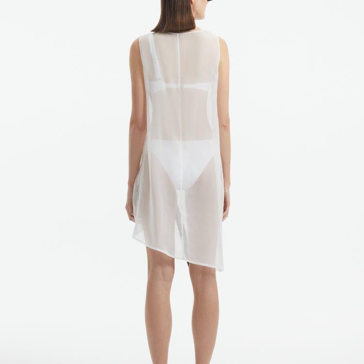 Adora White Sheer Sleeveless Asymmetric Dress with Gold Button Detail | Moeva | Dress | Each week unveils new pieces—luxury swimwear, fluid resort silhouettes, and elevated summer-to-evening essentials designed to carry you from coastal escapes to city nights.