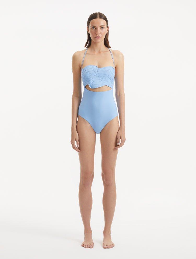 Front view of Adria Blue Swimsuit showcasing its wavy texture detailed top, underwire support, and adjustable straps. The swimsuit's luxurious Italian fabric and elegant baby blue color are prominently displayed