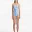 Front view of Adria Blue Swimsuit showcasing its wavy texture detailed top, underwire support, and adjustable straps. The swimsuit's luxurious Italian fabric and elegant baby blue color are prominently displayed