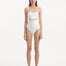 Front view of Adria White Swimsuit featuring wavy texture detailing, underwire support, and adjustable straps. The swimsuit’s elegant design and luxurious Italian fabric are prominently displayed.