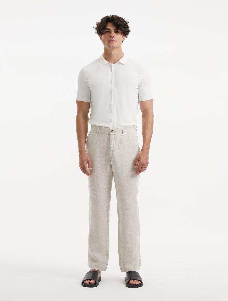 Front view of the model in Adrian Beige Pants, highlighting the elegant design, comfortable fit, and modern ankle-length cut.