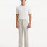 Front view of the model in Adrian Beige Pants, highlighting the elegant design, comfortable fit, and modern ankle-length cut.