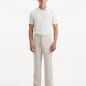 Front view of the model in Adrian Beige Pants, highlighting the elegant design, comfortable fit, and modern ankle-length cut.