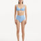 Model showcasing the Adva Baby Blue Bikini Bottom, highlighting the high-waisted design and serene blue color.
