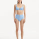 Model showcasing the Adva Baby Blue Bikini Bottom, highlighting the high-waisted design and serene blue color.