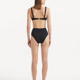 Rear view of the Adva Black Bikini Top, showcasing adjustable straps and secure fit.