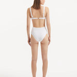 Rear view of the Adva White Bikini Bottom, emphasizing the elegant fit and luxurious fabric.