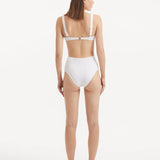 Rear view of the Adva White Bikini Bottom, emphasizing the elegant fit and luxurious fabric.