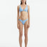 Aeron Baby Blue Bikini Bottom with hipster cut, showcasing shell-inspired gold button accents.