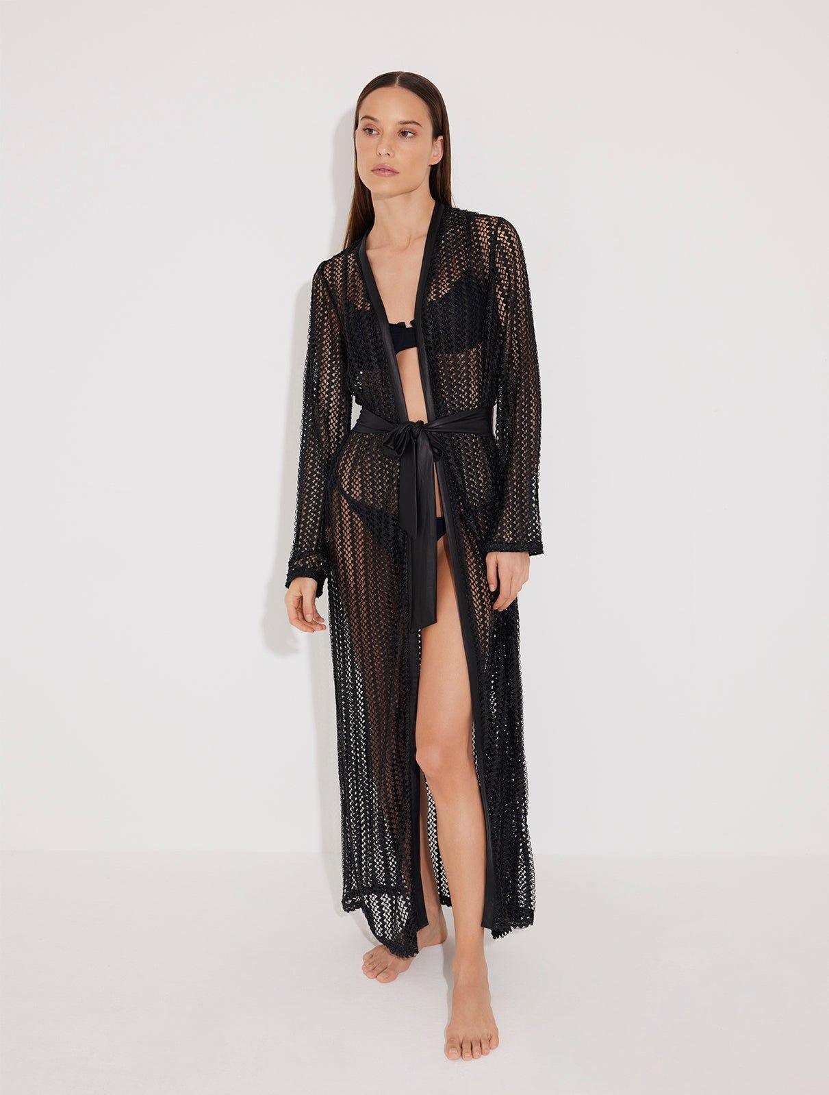 Front View: Model in Aitana Black Kaftan - MOEVA Luxury Swimwear, Loose Fit, Self-Tie Belt, Long-Sleeved, Chain Knitted Fabric, MOEVA Luxury Swimwear