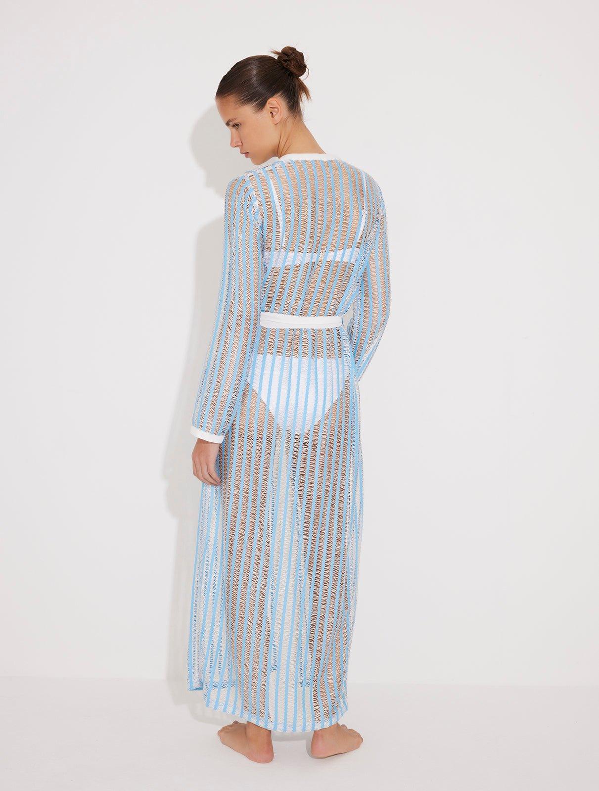 "Back view of the Aitana Blue/White Kaftan, showcasing its ankle-length silhouette, long sleeves, and crisscross knit detailing"