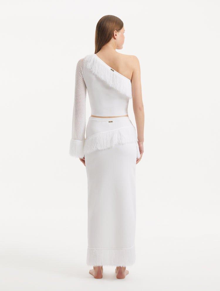 "Back view of the Alani White Skirt, demonstrating the high-waisted silhouette and elegant drape."