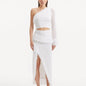 "Model wearing the Alani White Skirt from the front, showcasing the high-waisted fit and elegant knitted texture."