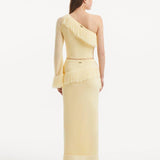 "Back view of the Alani Yellow Skirt, featuring the high-waisted design and showcasing the elegant drape of the knit fabric."