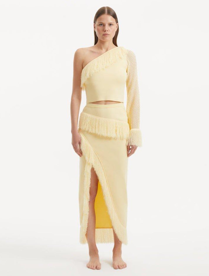 Alani Yellow Fringe Detail Asymmetric Slit Midi Skirt | Moeva | Skirt | Each week unveils new pieces—luxury swimwear, fluid resort silhouettes, and elevated summer-to-evening essentials designed to carry you from coastal escapes to city nights.