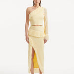 "Model showcasing the Alani Yellow Skirt from the front, highlighting the high-waisted fit, intricate knitwork, and playful fringed hem."