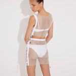 "Back view of Alejandra Skirt highlighting its shimmering design and stylish silhouette."
