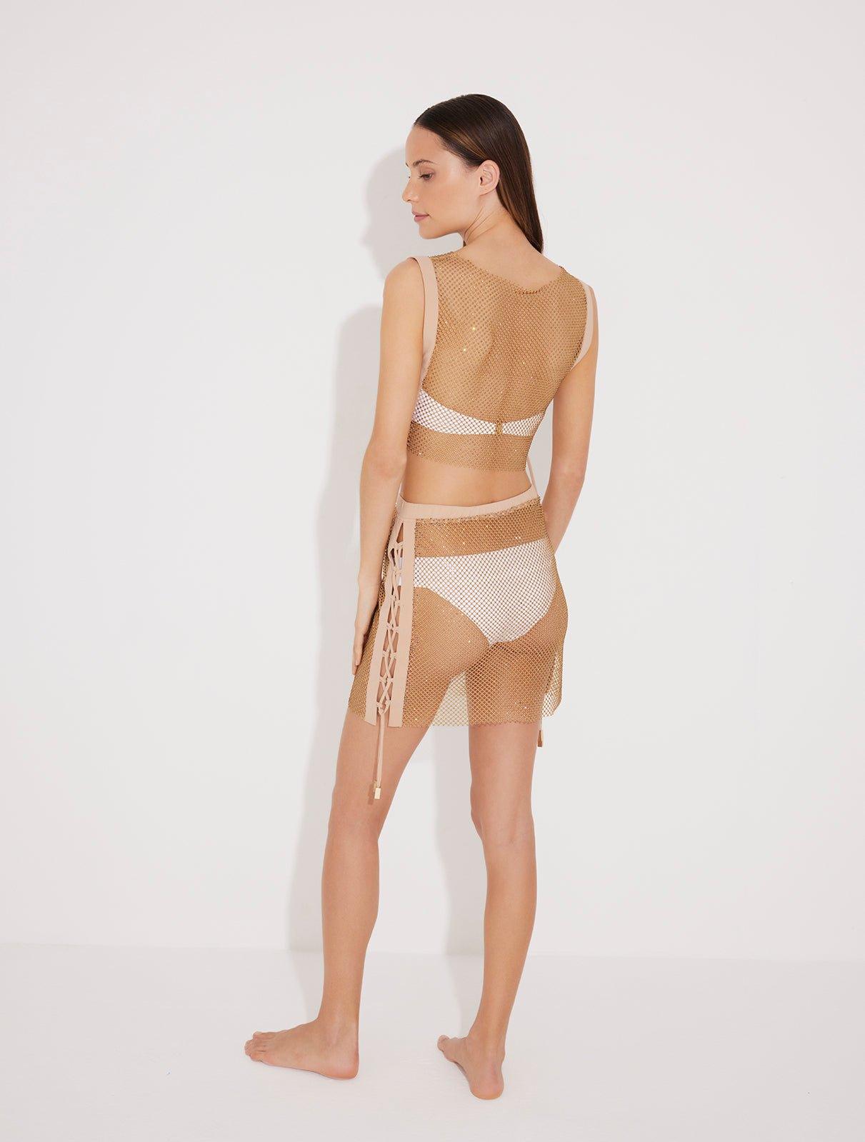 "Back view of Alejandra Top and Skirt highlighting its shimmering design and stylish silhouette."