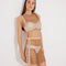 "Model wearing Alejandra Nude Rhinestone Top and Skirt from the front, highlighting its dazzling rhinestone design."