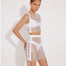 "Model wearing Alejandra White Rhinestone Skirt from the front, highlighting its dazzling rhinestone design."