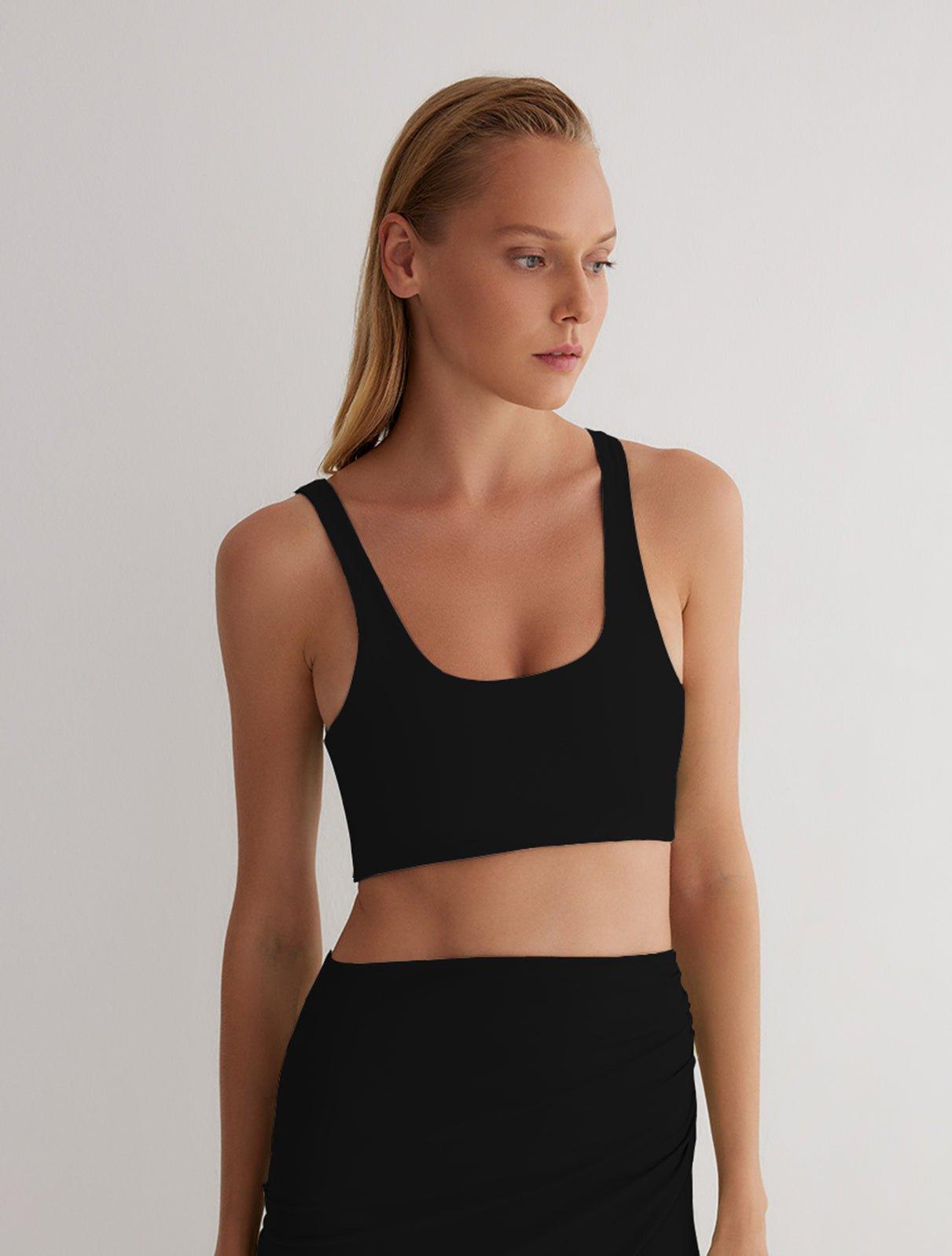 "Front view of a model wearing Alva Black/Camel Crop Top, showcasing the scoop neckline and sleek fit."