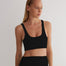 "Front view of a model wearing Alva Black/Camel Crop Top, showcasing the scoop neckline and sleek fit."