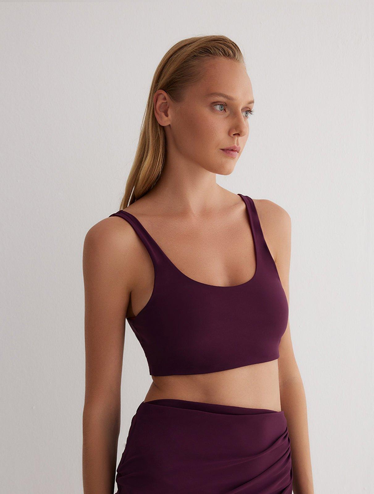 "Front view of a model wearing Alva Prune/Bordeaux Crop Top, showcasing the scoop neckline and sleek fit."