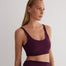 "Front view of a model wearing Alva Prune/Bordeaux Crop Top, showcasing the scoop neckline and sleek fit."