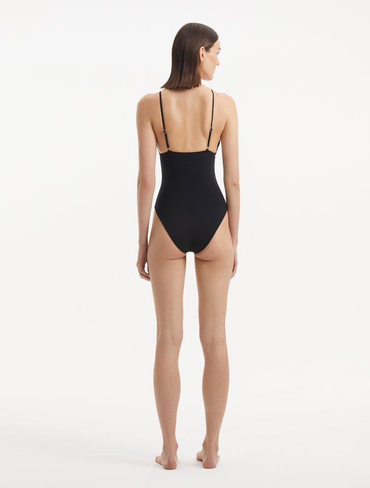 Rear view of the Anahita Black Swimsuit, highlighting adjustable straps and sleek silhouette.