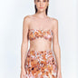 Front View: Model in Antonia Floral Abstract Skirt - MOEVA Luxury Swimwear, Wrap Style, Slim Fit, High Rise, Thigh Length Skirt, MOEVA Luxury Swimwear