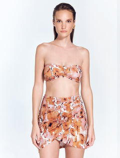 Front View: Model in Antonia Floral Abstract Skirt - MOEVA Luxury Swimwear, Wrap Style, Slim Fit, High Rise, Thigh Length Skirt, MOEVA Luxury Swimwear