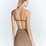 Back View: Model in Antonia Nude Skirt - MOEVA Luxury Swimwear, Made Of Swimwear Fabric, Special Lycra Xtralife Certificate, Mini Skirt, Unlined, Comfort and Day to Night, Soft Touch Fabric, MOEVA Luxury Swimwear