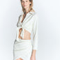 Front View: Model in Antonia Seersucker White Skirt - MOEVA Luxury Swimwear, Wrap Style, Slim Fit, High Rise, Thigh Length Skirt, MOEVA Luxury Swimwear