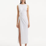 "Model showcasing the Apollo White Dress from the front, highlighting the elegant boat neckline, twist knot detail at the waist, and luxurious satin fabric."