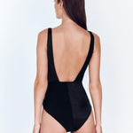 "Back view of the Aria Black Swimsuit with emphasis on the low back and moderate coverage."
