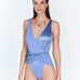  "Model wearing the Aria Swimsuit from the front, showcasing the V neckline, wrap-around front, and high-cut leg in a combination of matte and satin fabric."