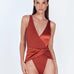 "Aria Red Ochre Swimsuit featuring a V neckline, wrap-effect front, and high-cut leg. Made from matte and satin fabric for an alluring look."