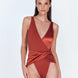 "Aria Red Ochre Swimsuit featuring a V neckline, wrap-effect front, and high-cut leg. Made from matte and satin fabric for an alluring look."