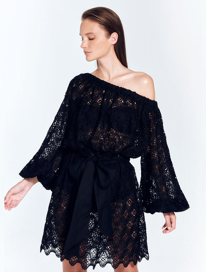 Front View: Model in Arlinda Black Dress - Mini Dress, Unlined, Day to Night, Guipure Lace, Blouson Long Sleeves, MOEVA Luxury Swimwear