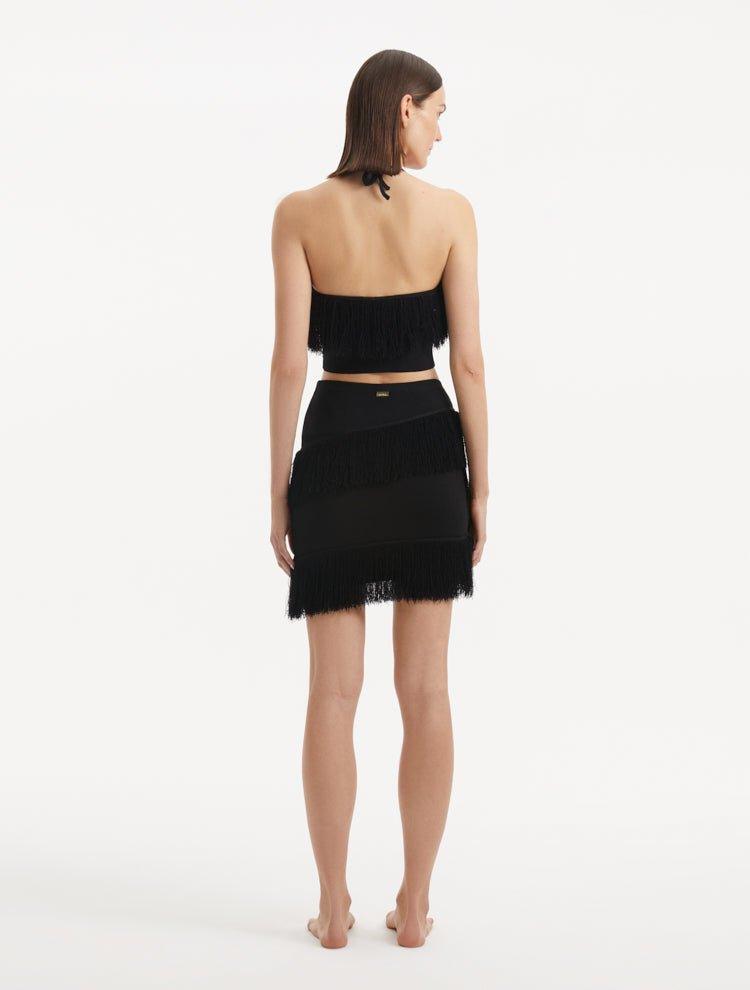 "Back view of the Arlo Black Skirt, displaying the high-rise cut and elastic waistband that ensure a flattering fit and comfort."
