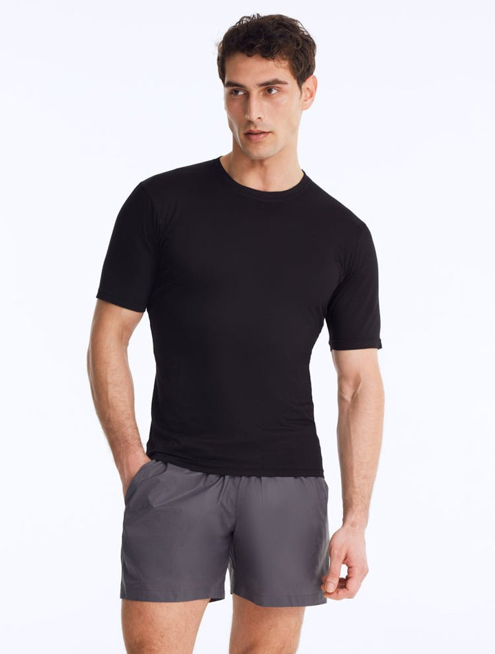 Front View: Model Wearing Men's Atlas Black T-Shirt - Crew Neck, Slim Fit, Woven Cotton, Short-Sleeved, MOEVA Luxury Swimwear