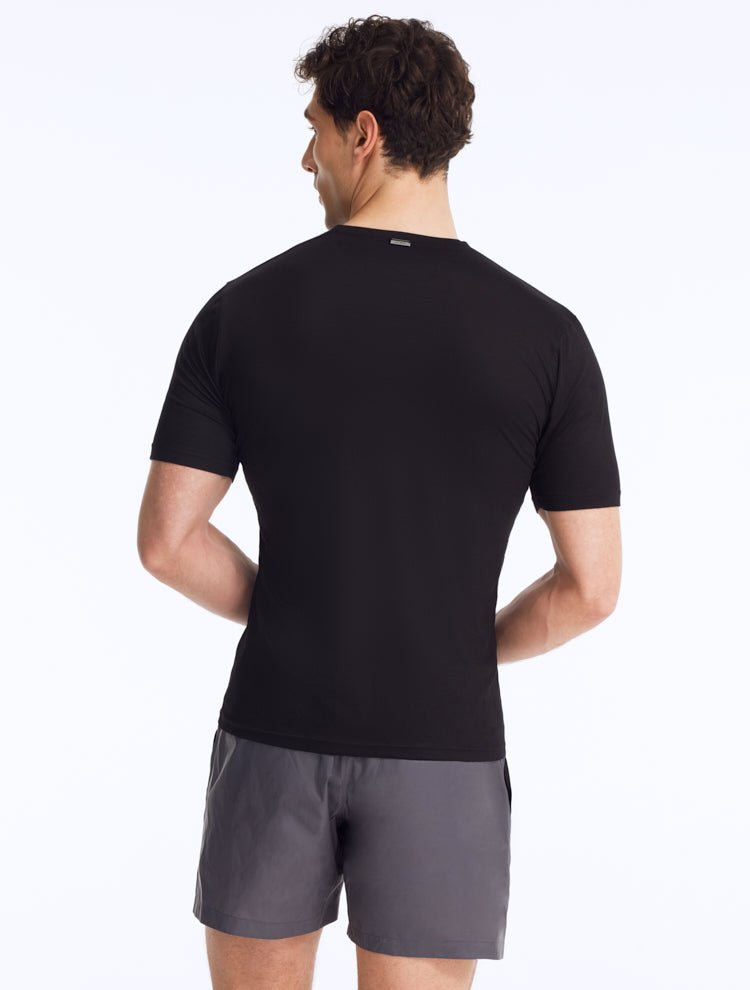 Back View: Model Showing Atlas Black T-Shirt - Men's Slim Fit Tee, Embroidered Moeva Emblem, Short-Sleeve, Cotton, MOEVA Luxury Swimwear