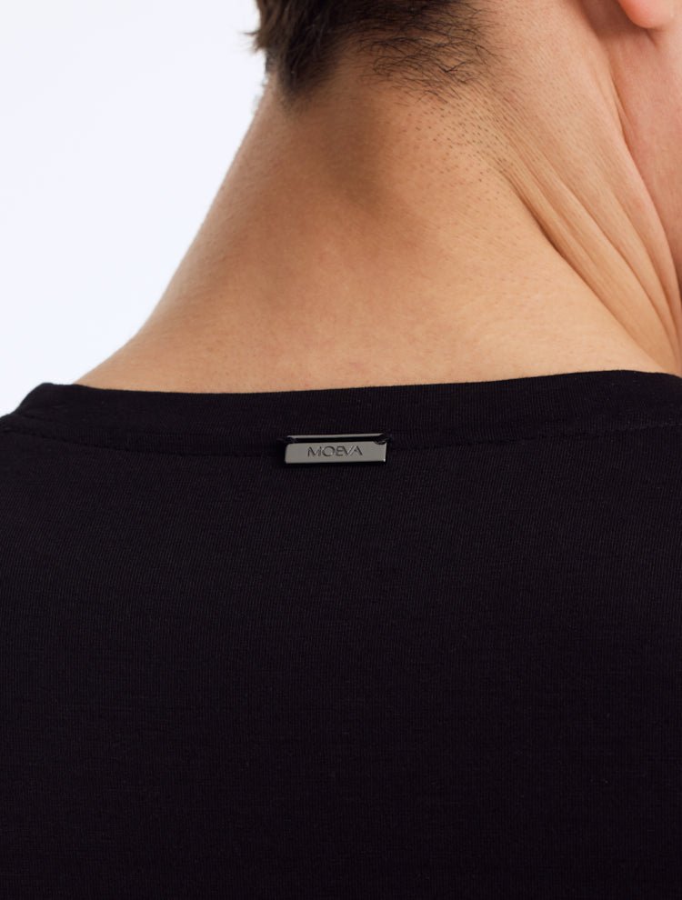 Back View: Model Wearing Atlas Black T-Shirt - Men's Slim Fit Tee, Embroidered Moeva Emblem, Cotton, MOEVA Luxury Swimwear