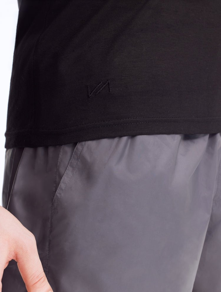 Close-Up: Model wearing Atlas Black T-shirt - Slim Fit, High-Quality Cotton, MOEVA Luxury Swimwear