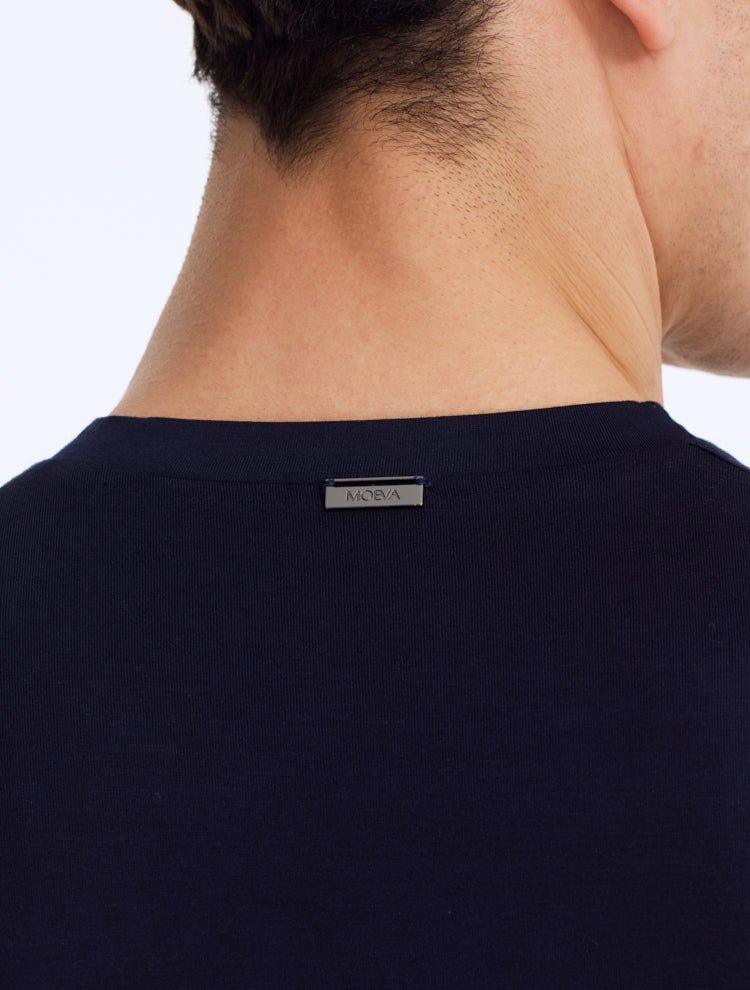 Close-up of a model wearing the Atlas Dark Blue Crew Neck T-Shirt, showcasing the sleek crew neckline and premium fabric. The slim fit highlights the model's silhouette.